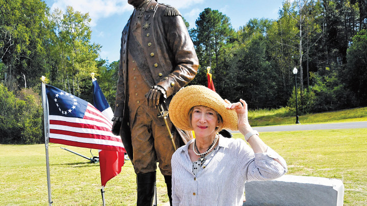 woman standing in front of monument