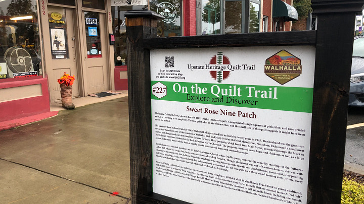 Sidewalk signage in downtown Walhalla for Upstate Heritage Quilt Trail