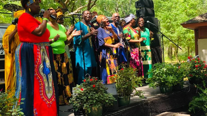 Historic Mitchelville, people singing on stage