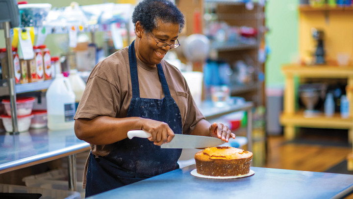 Woman slicing pound cake
